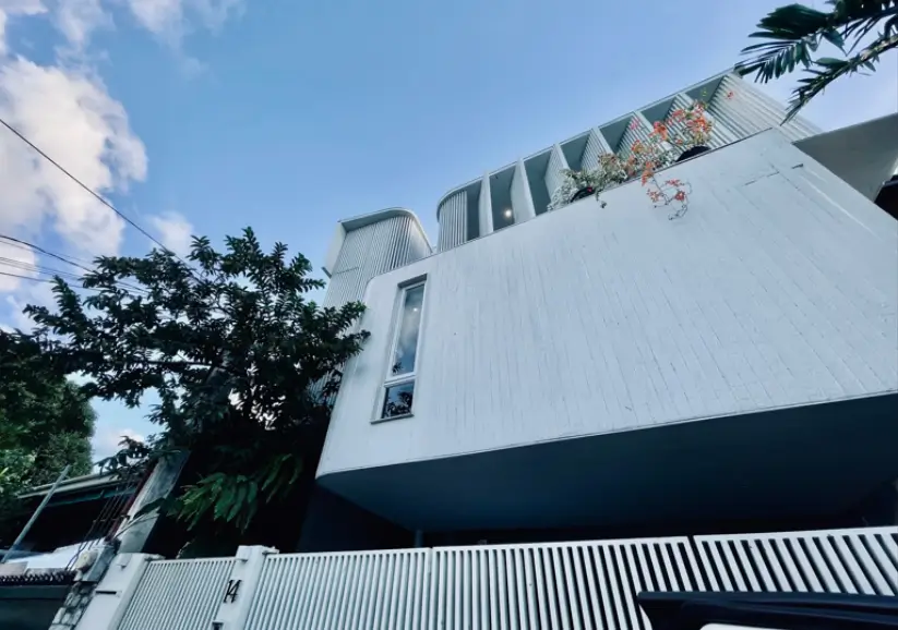 Low Angle View of White Concrete Screen and Blue Sky